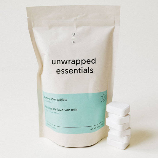 Unwrapped Essentials package with dishwasher tablets on a white background
